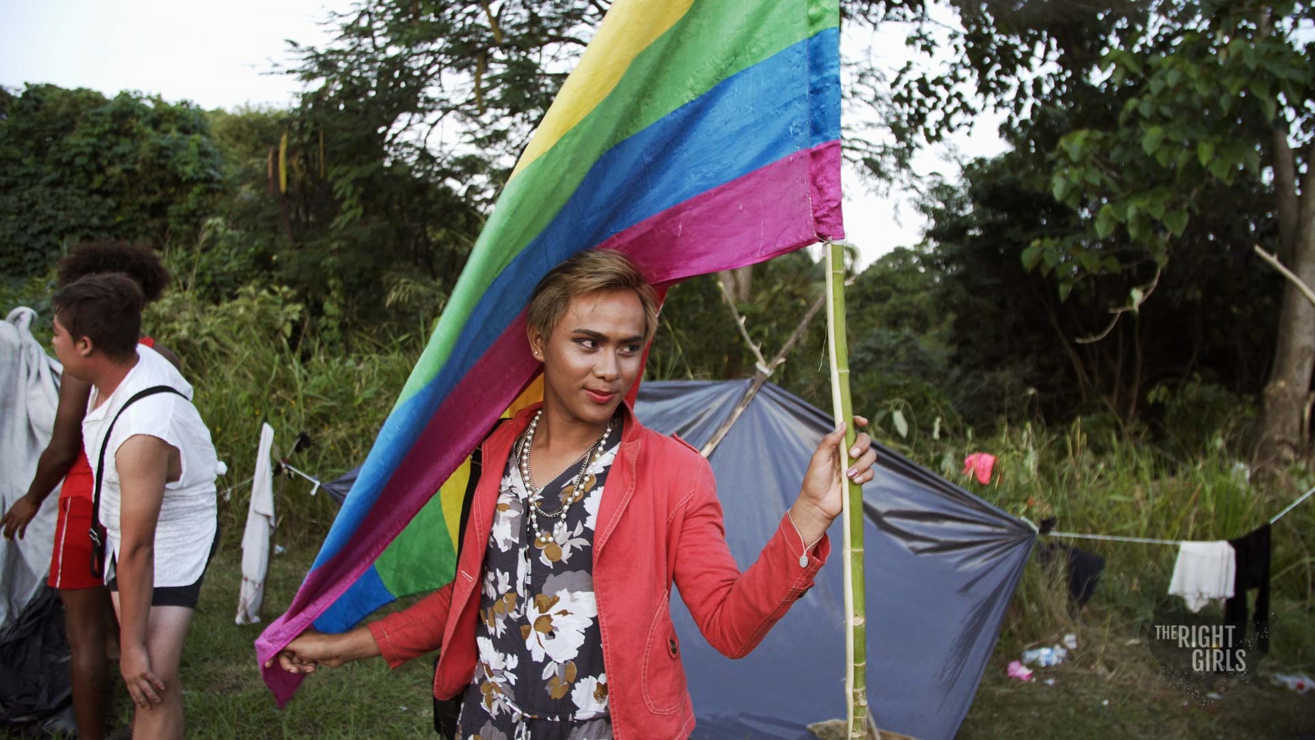 Valentyna posing with LGBTQ flag.